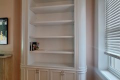 Curved white built in cabinet