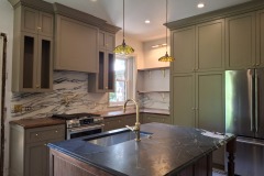 Custom-built-green-and-walnut-kitchen-cabinets