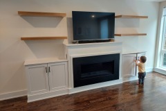 Cabinets-around-TV-with-fireplace