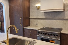 Custom-walnut-kitchen-cabinets-stove-hood